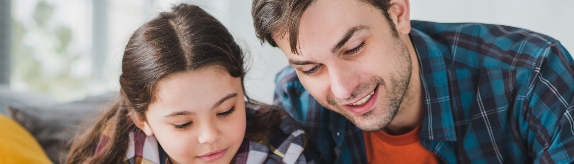 fathers day concept with father daughter reading